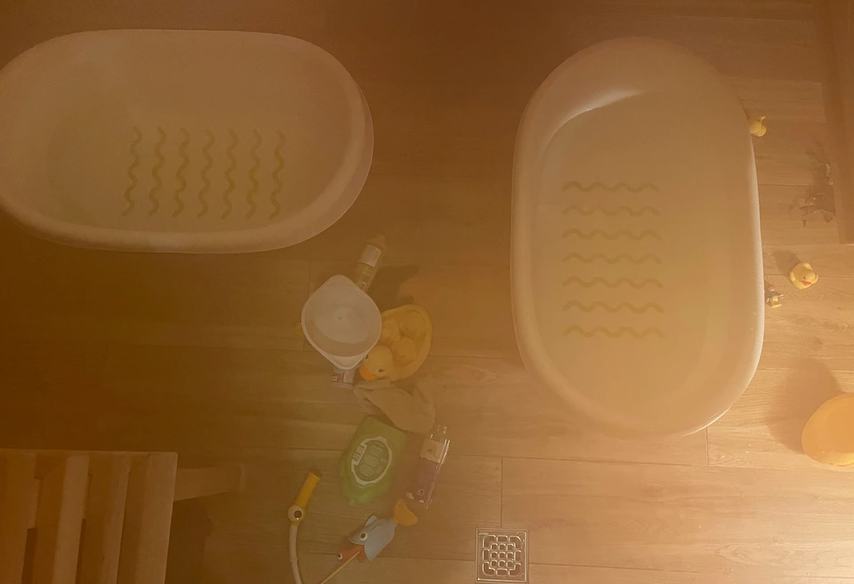 “Kid bathtubs in the steam of sauna”