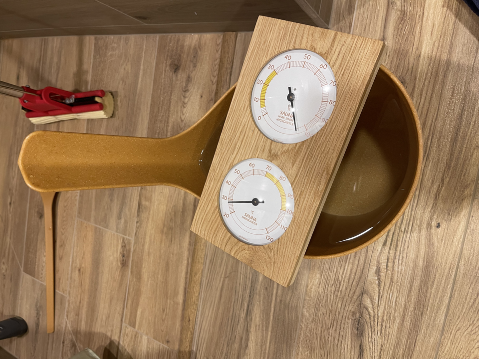 “Hygrometer positioned on water bucket”